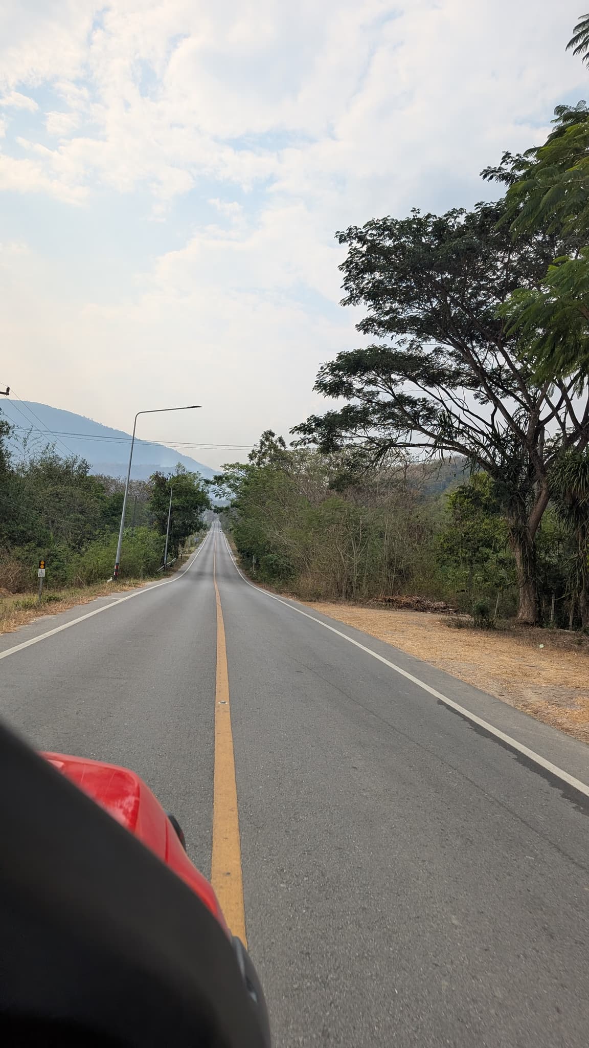 Straight road toward mountains