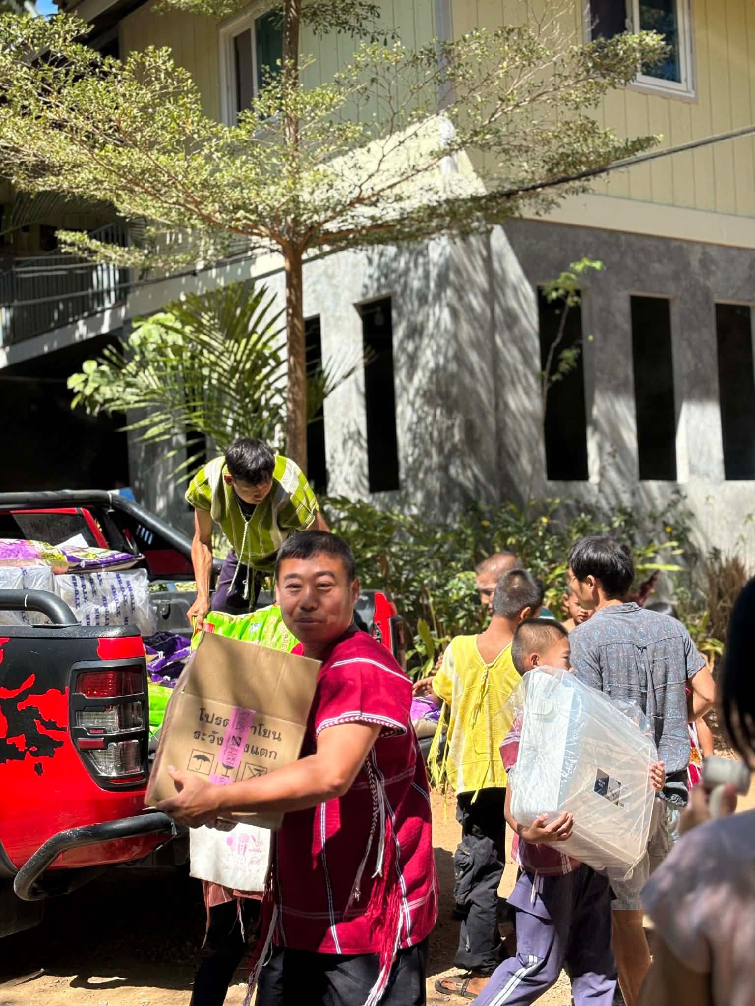 Samson carrying box from truck