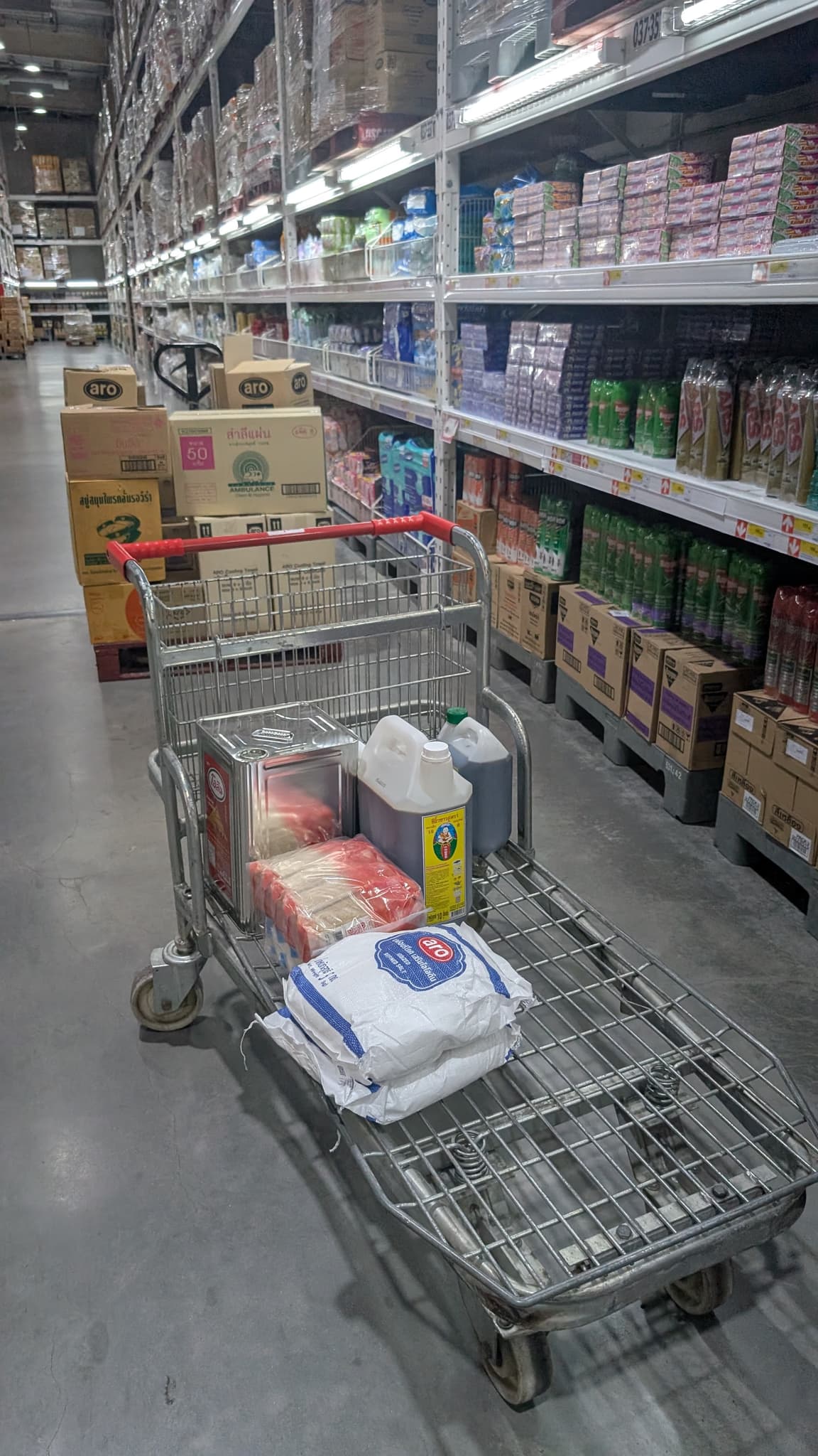Cart in cleaning aisle with salt, oil, soap