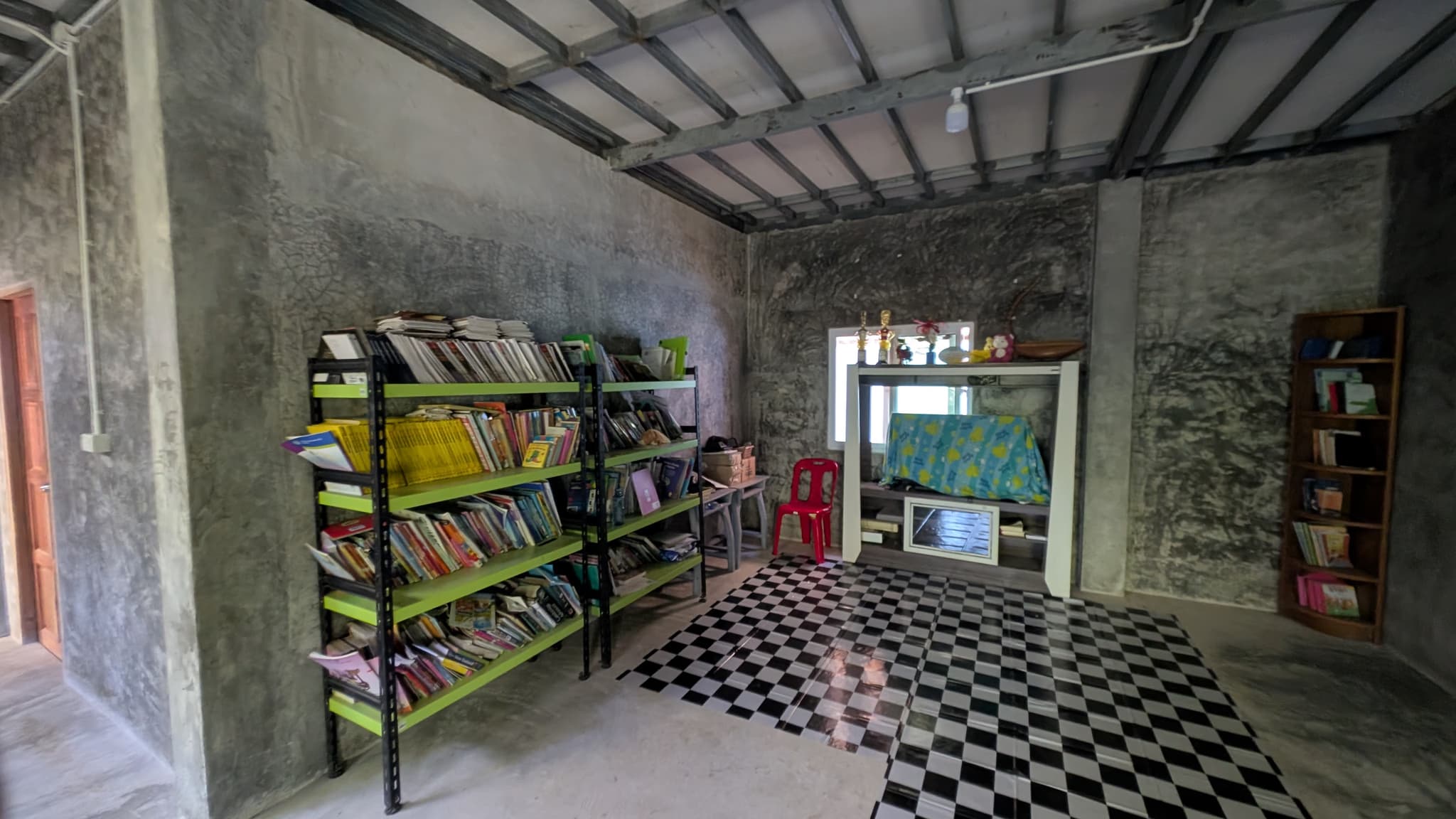 Library with green bookshelves