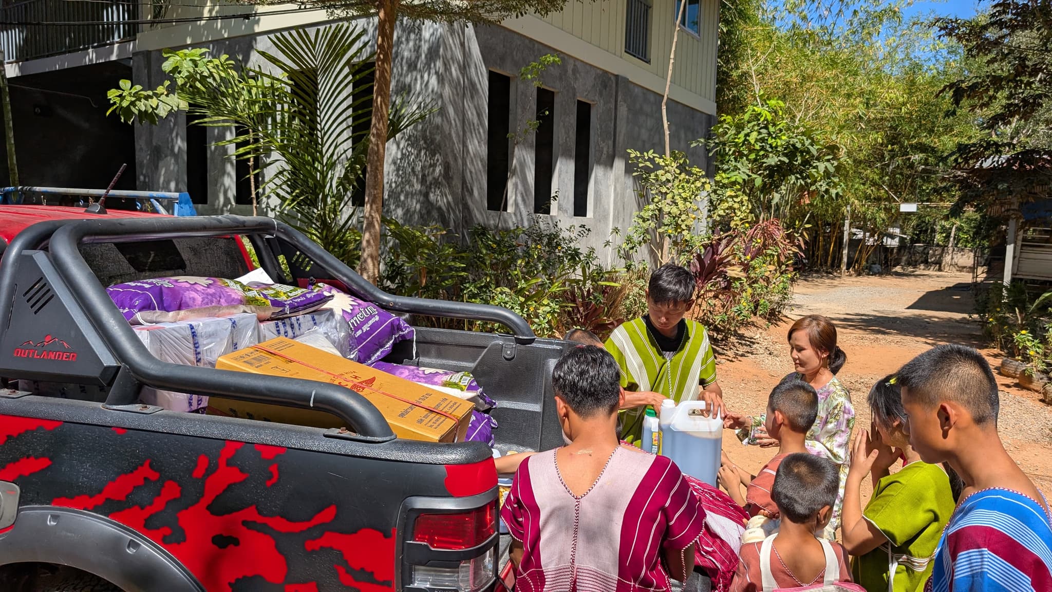 Children helping unload truck