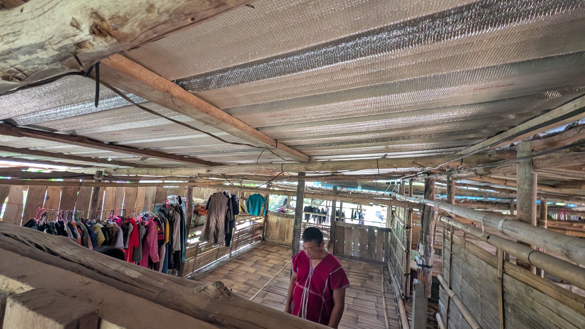 Karen girl climbing bamboo stairs