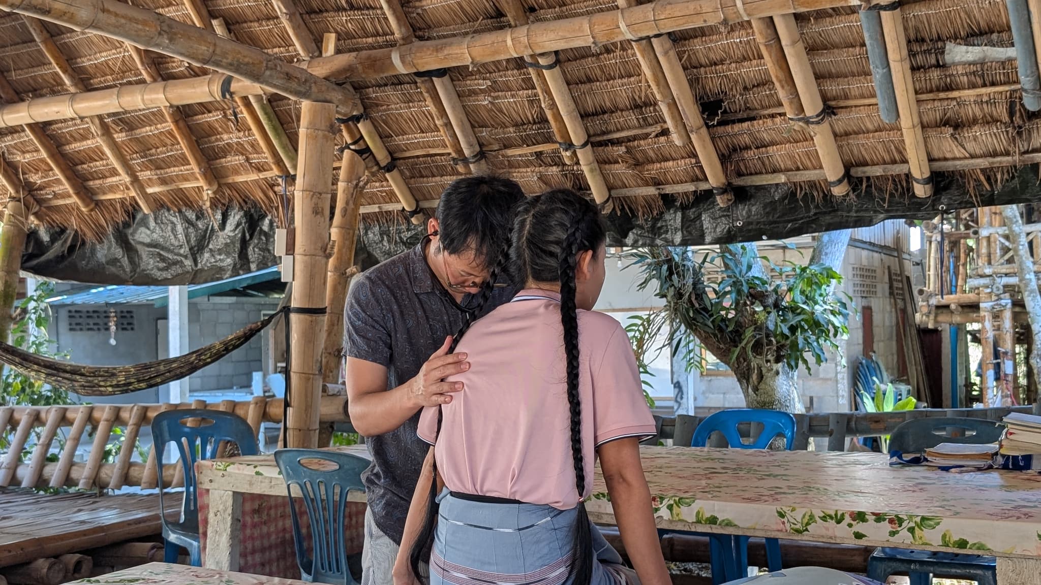 Dr. Mo giving medical checkup to Karen girl