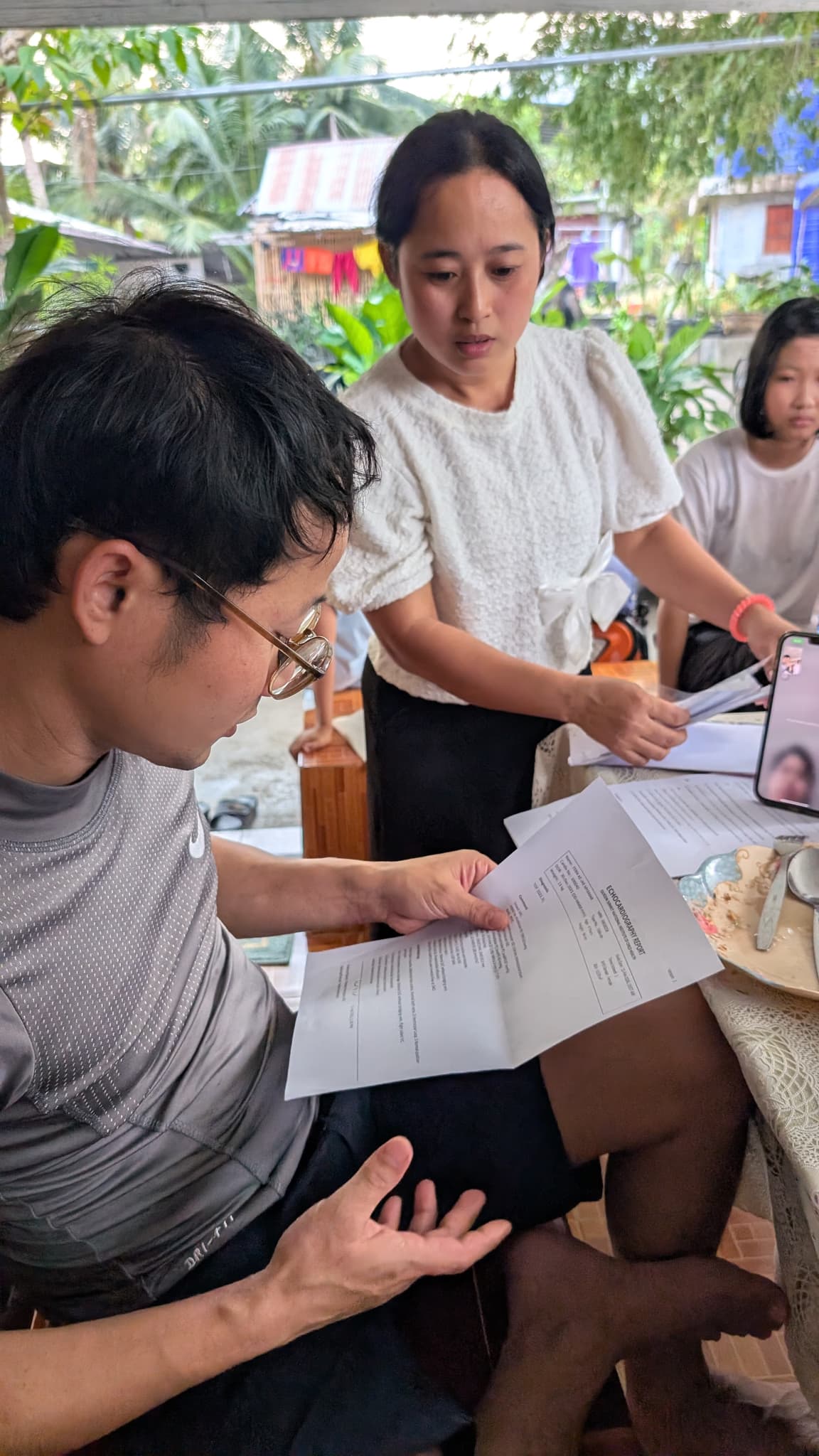 Dr. Mo checking medical documents